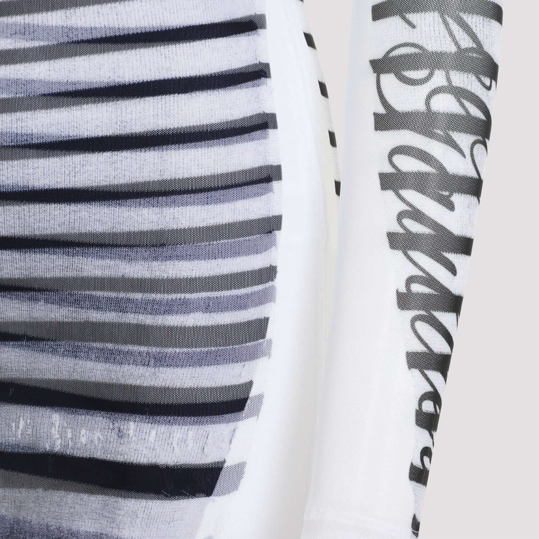 Close-up of a fabric with black and white stripes and a brand logo.