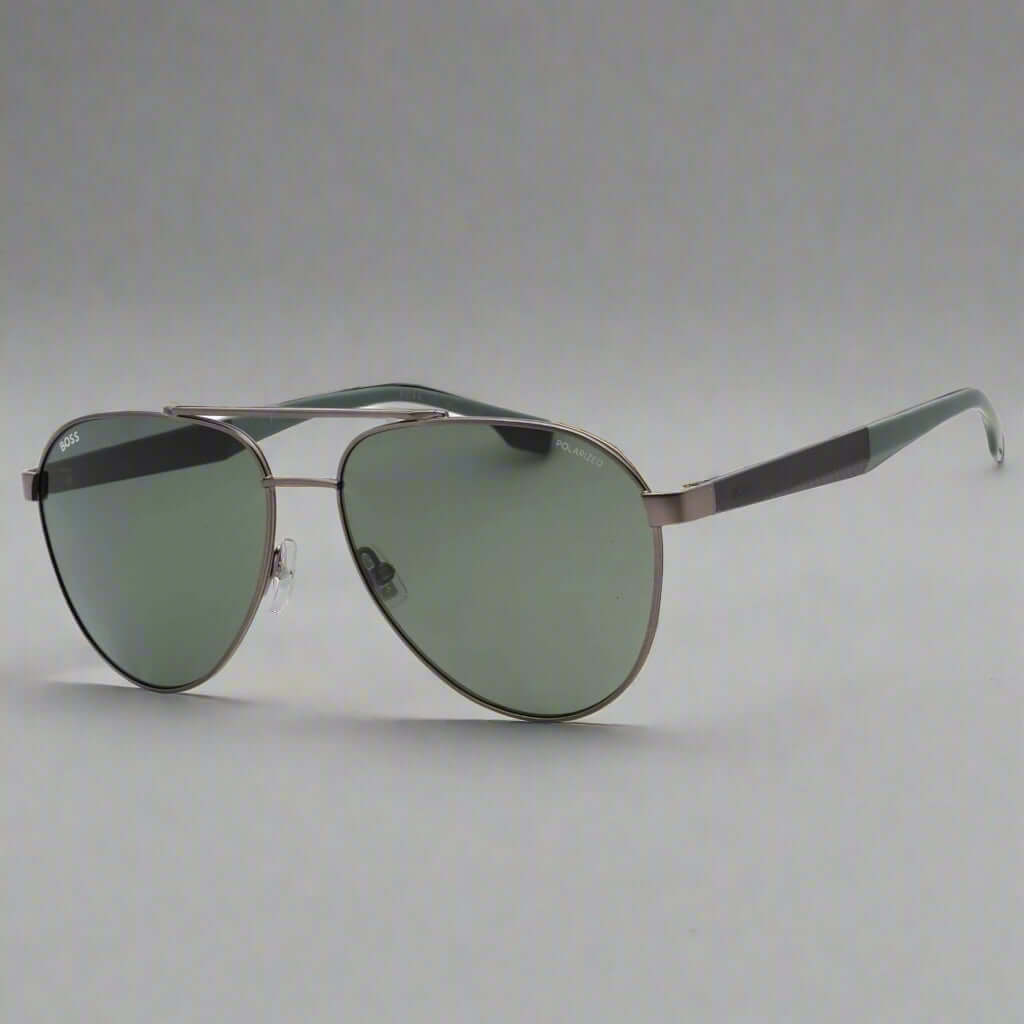 Aviator sunglasses with dark lenses and metal frame on a white background