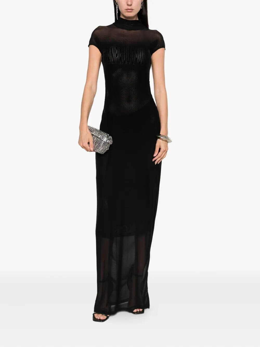 Woman wearing a black evening gown on a white background