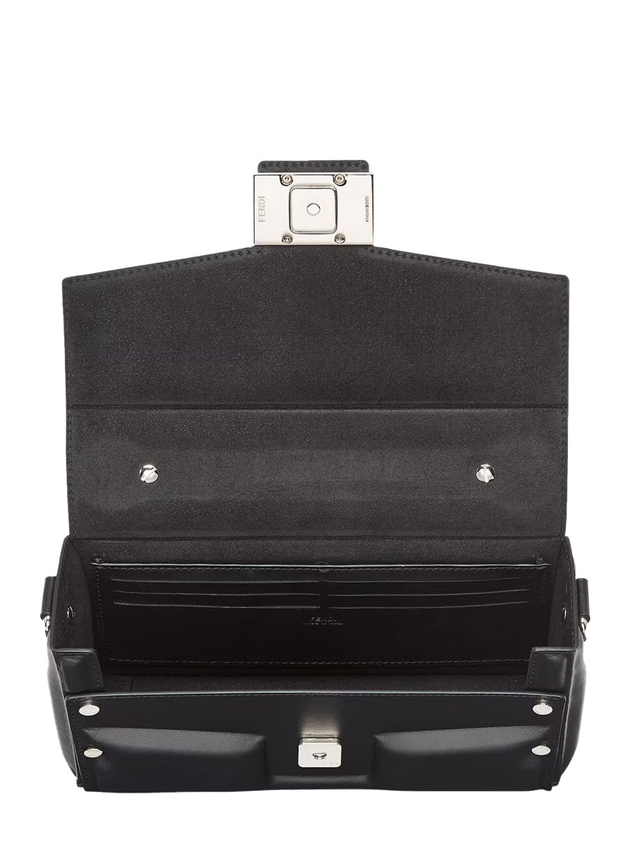 Black suitcase with open lid on a white background