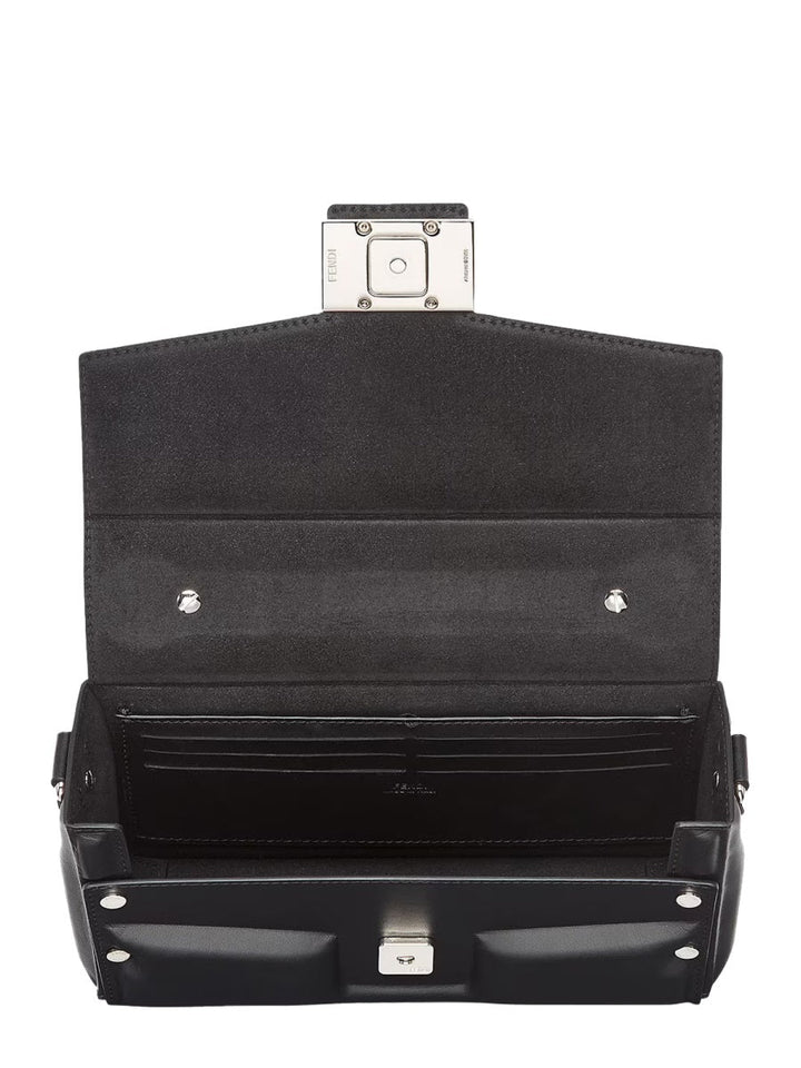 Black suitcase with open lid on a white background