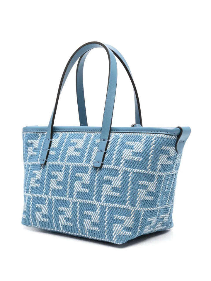 Blue handbag with a pattern on a white background