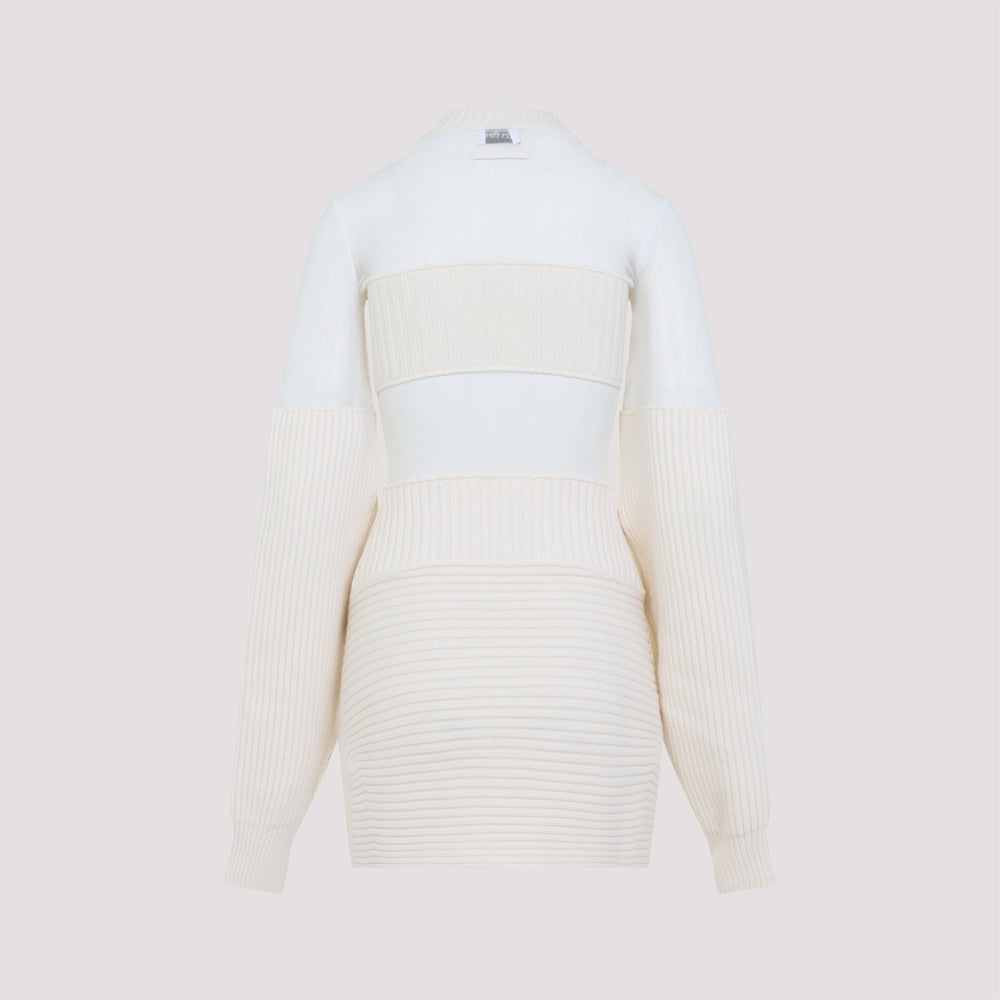 White ribbed sweater with beige accents on a light beige background