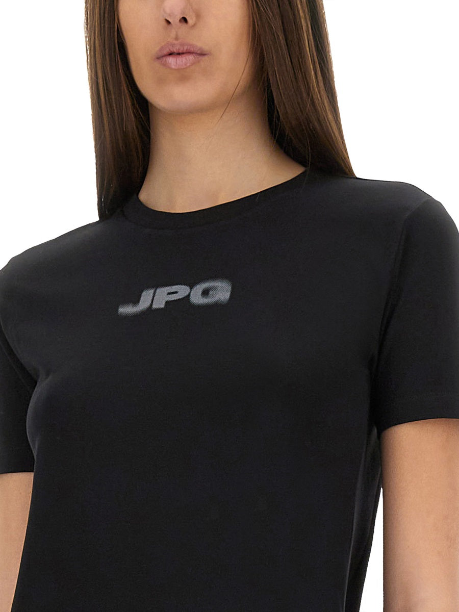 Person wearing a black t-shirt with 'JPG' logo on a white background
