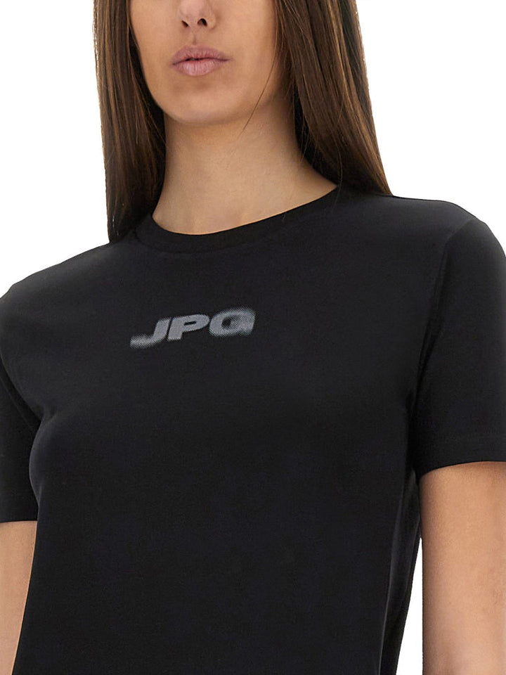 Person wearing a black t-shirt with 'JPG' logo on a white background