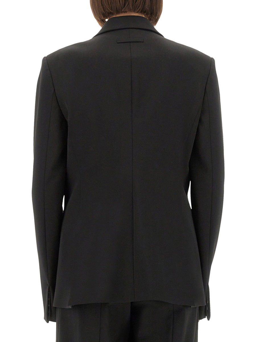 Black suit jacket on a white background