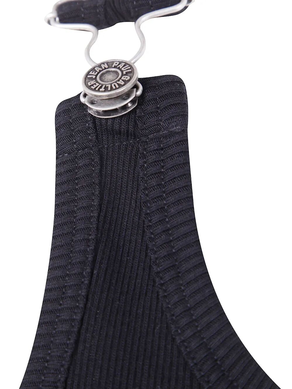 Black ribbed garment on a hanger with a visible brand tag.