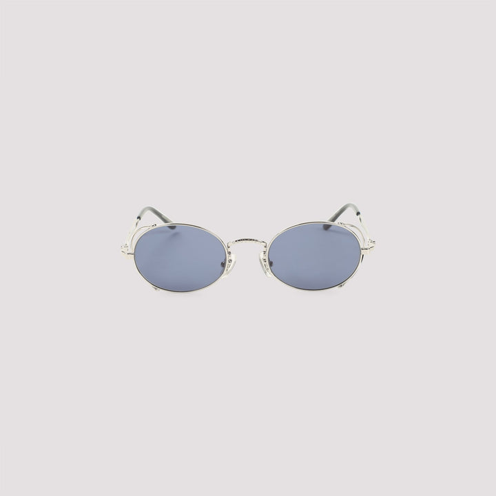 Round sunglasses with blue lenses on a light gray background