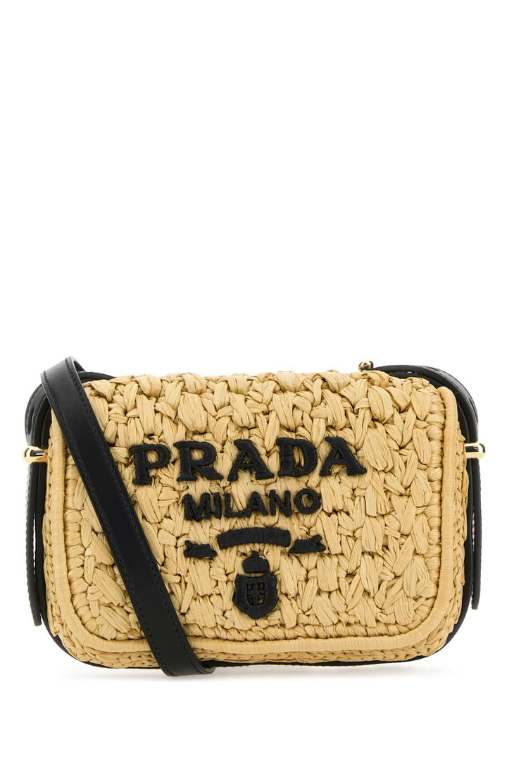 PRADA women raffia crossbody bag featuring black logo and adjustable strap on a straw-like material.