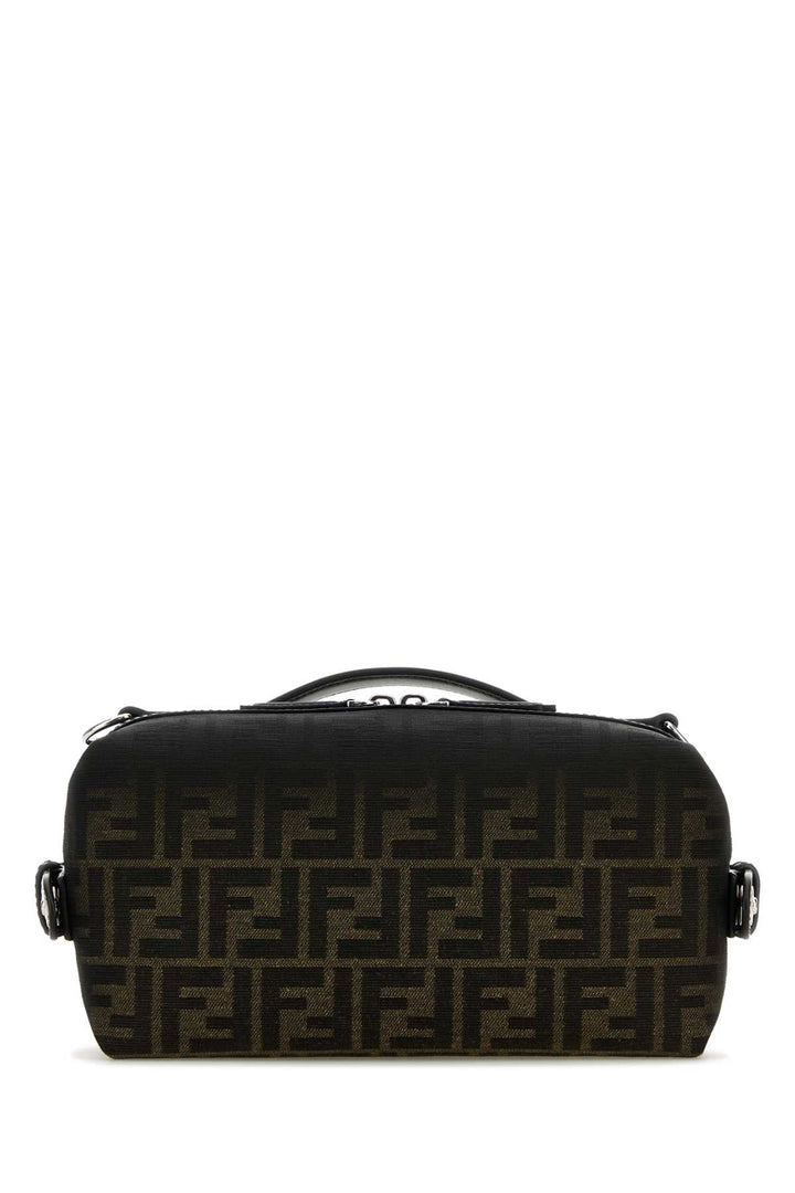 Black handbag with a pattern on a white background