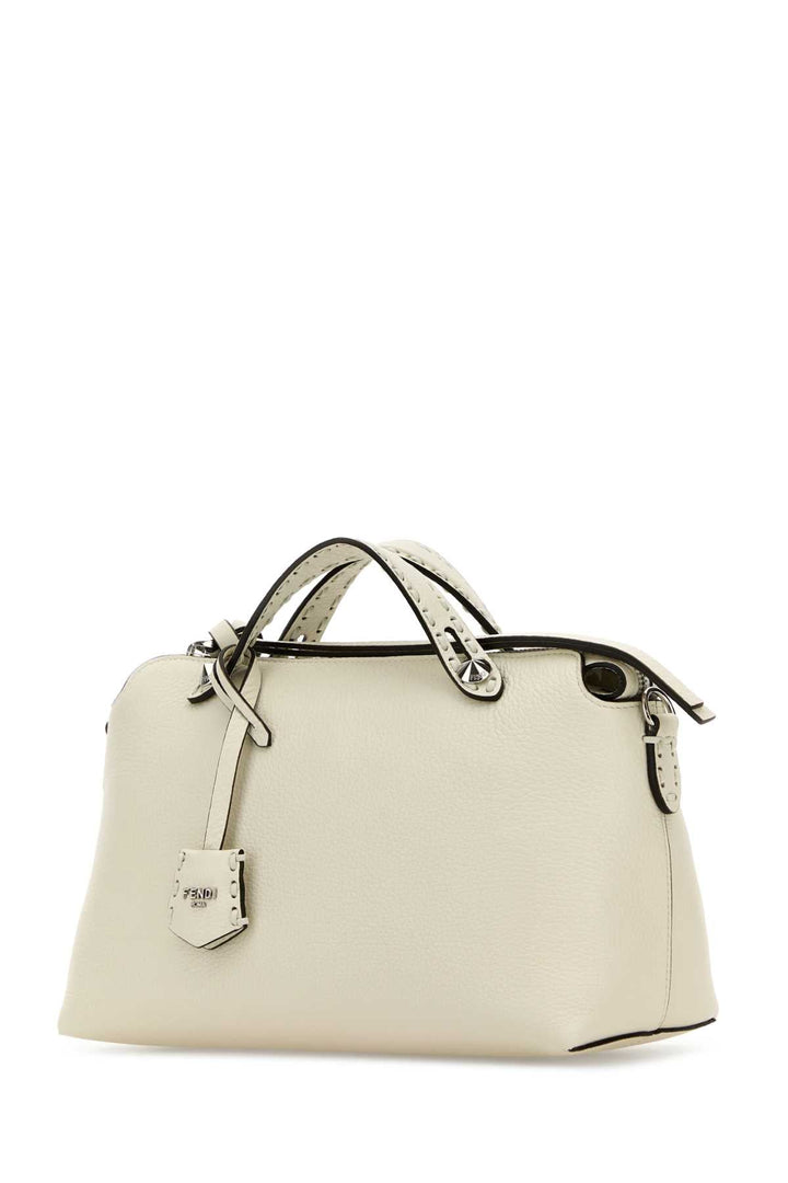 White handbag with a visible brand logo on a white background