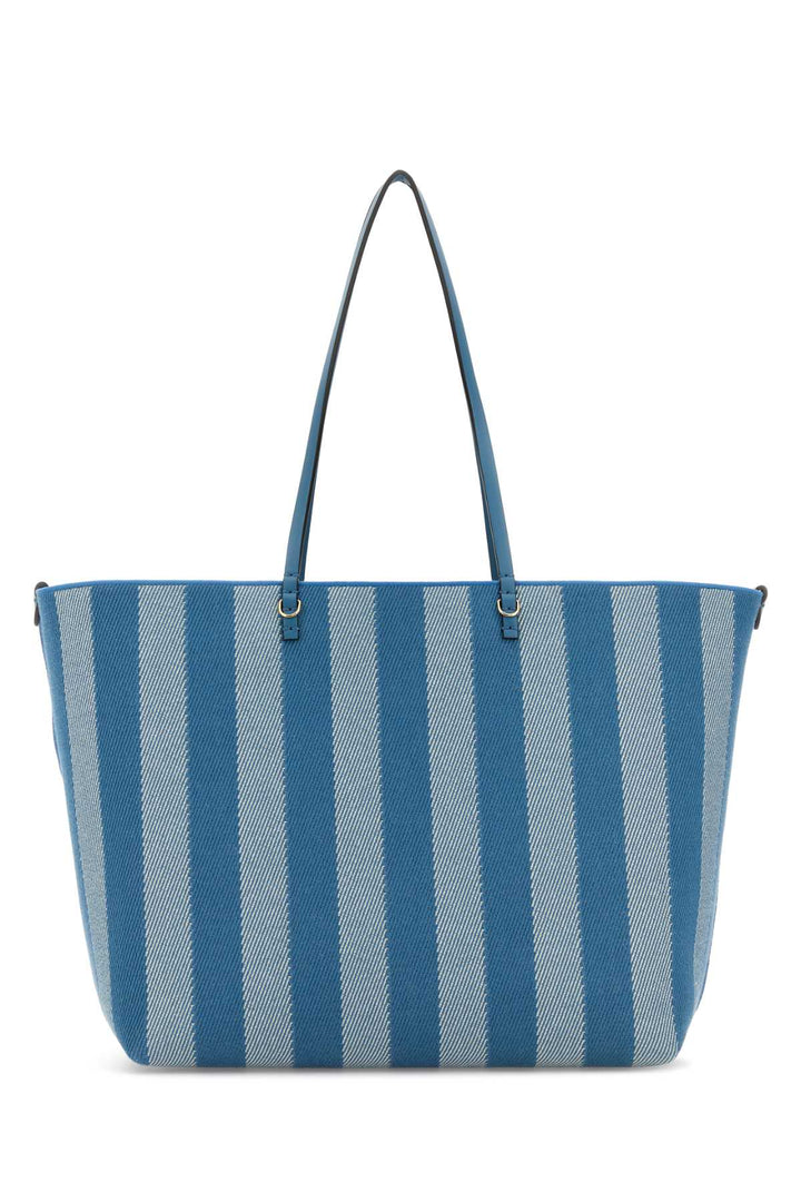 Blue and gray striped tote bag on a white background