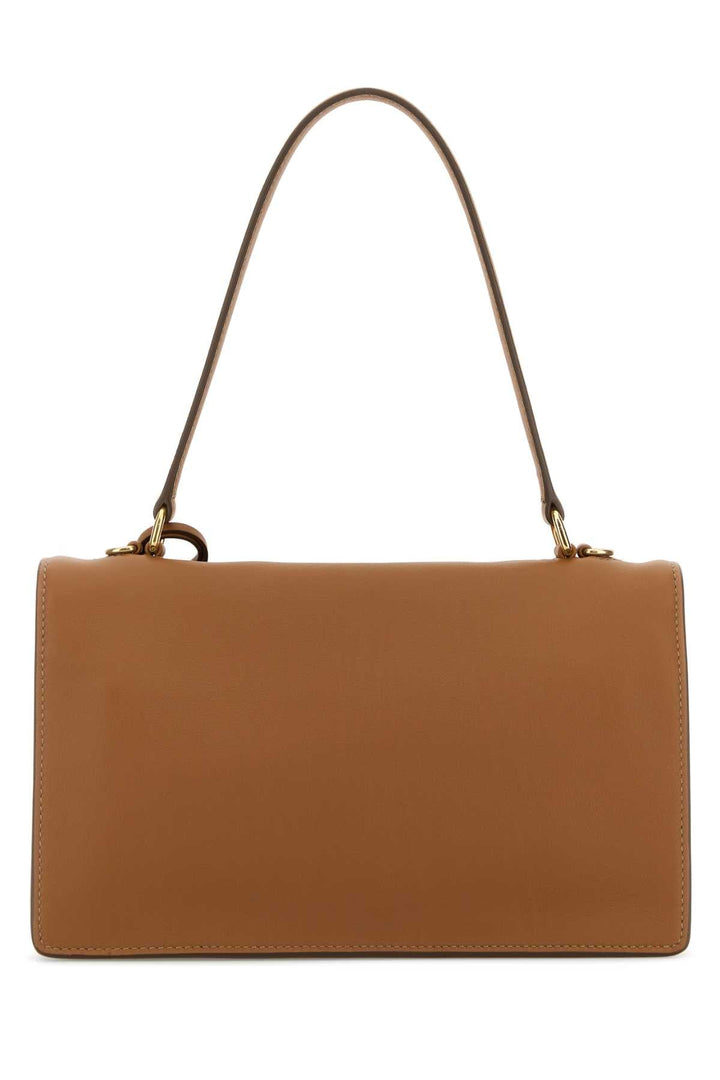 Brown handbag with a strap on a white background