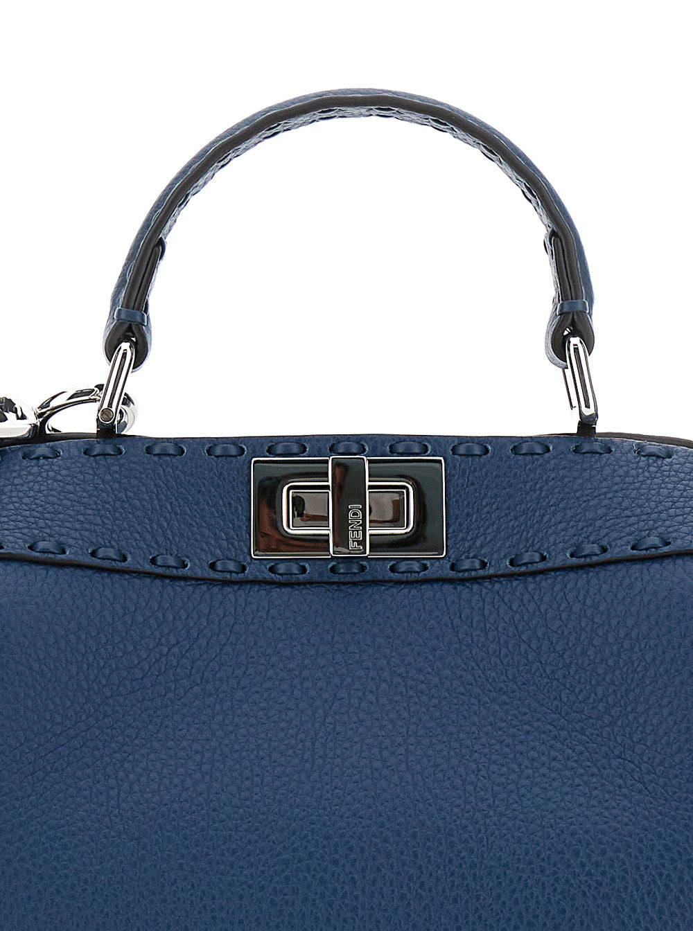 Blue handbag with a silver handle and clasp on a white background