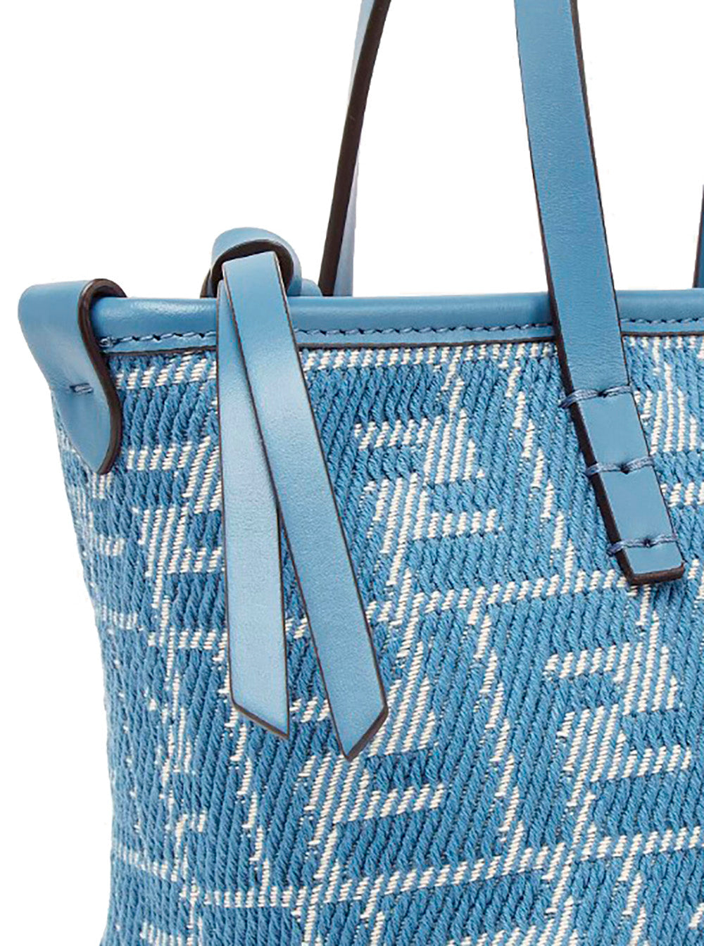 Blue woven handbag with leather straps on a white background