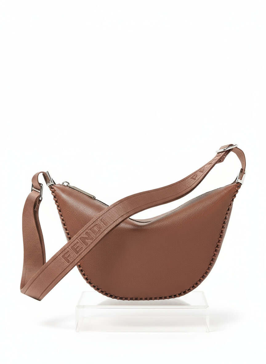 Brown leather bag with visible brand logo on a white background