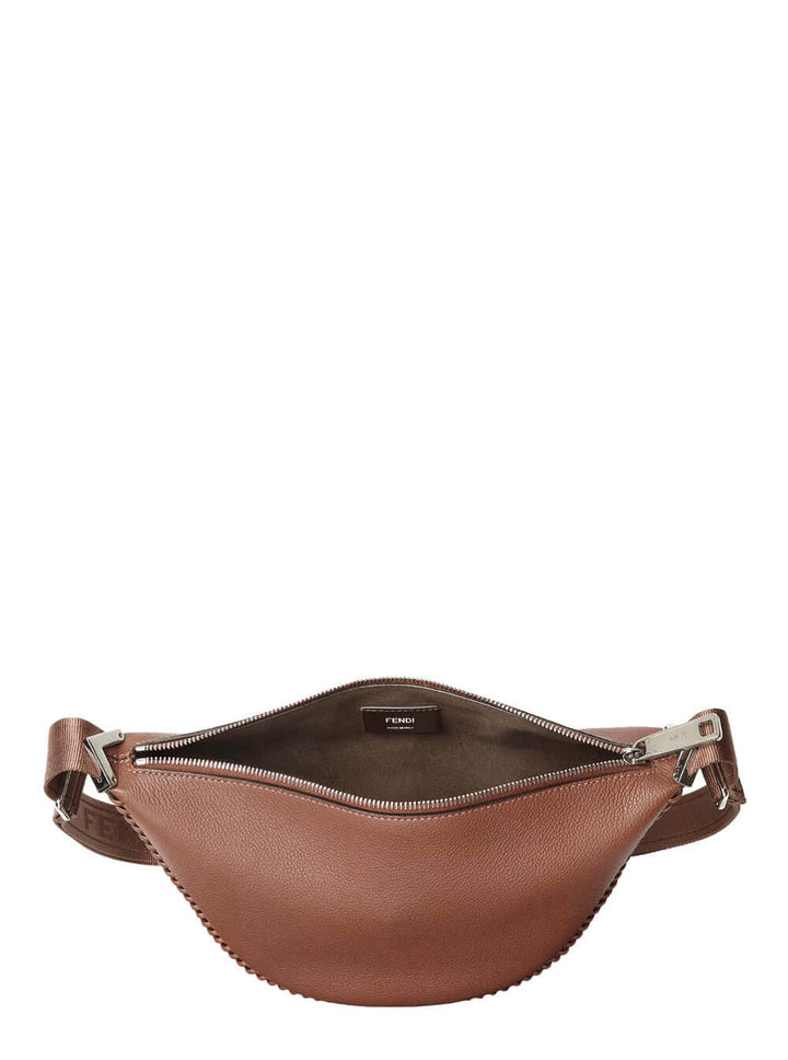 Brown leather waist bag with a visible brand label on a white background