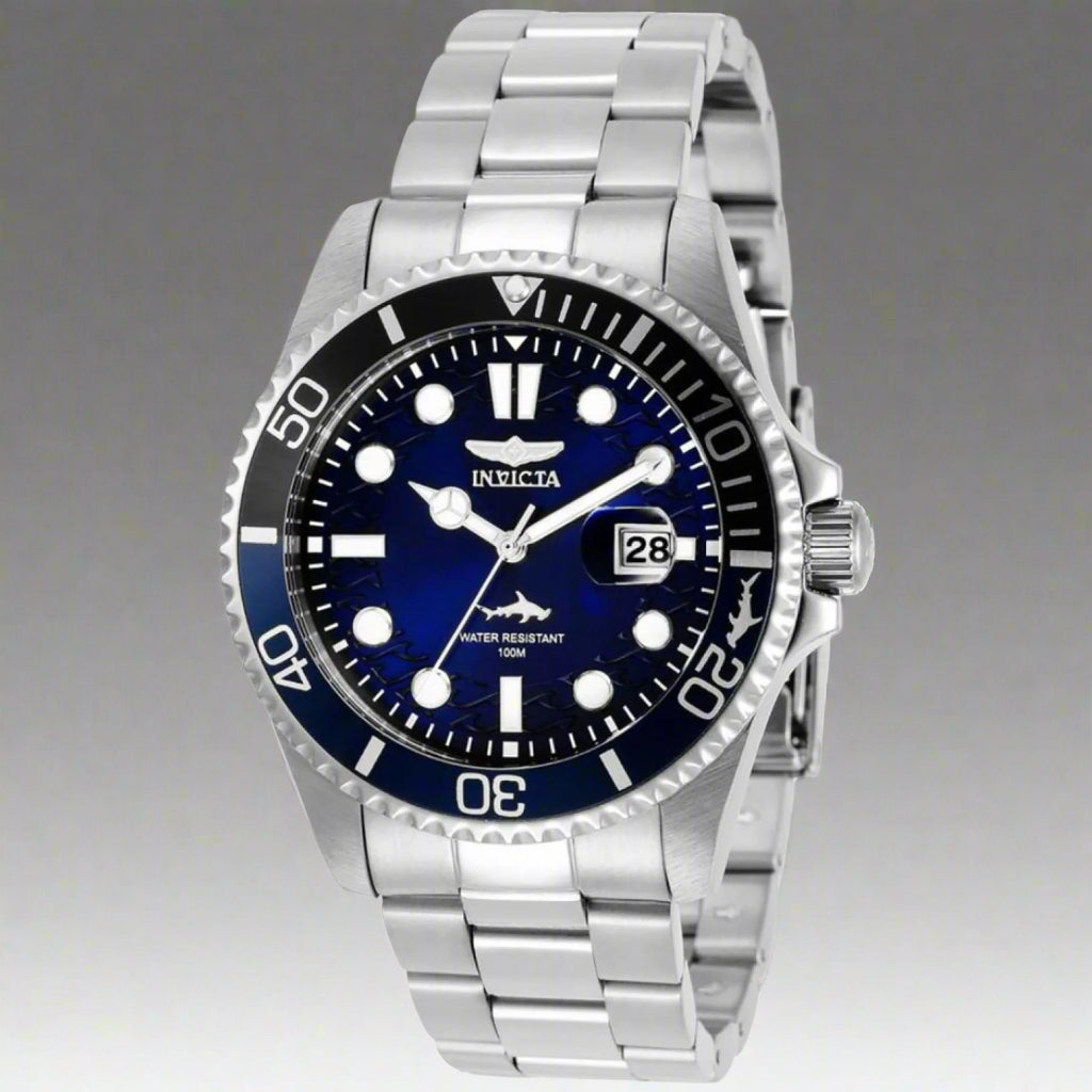 INVICTA Pro Diver men's watch with stainless steel band INVICTA black graphic t-shirt with logo front Gold-tone INVICTA chronograph wristwatch close-up INVICTA men's button-down shirt with embroidered detail INVICTA oversized sport watch and branded appar