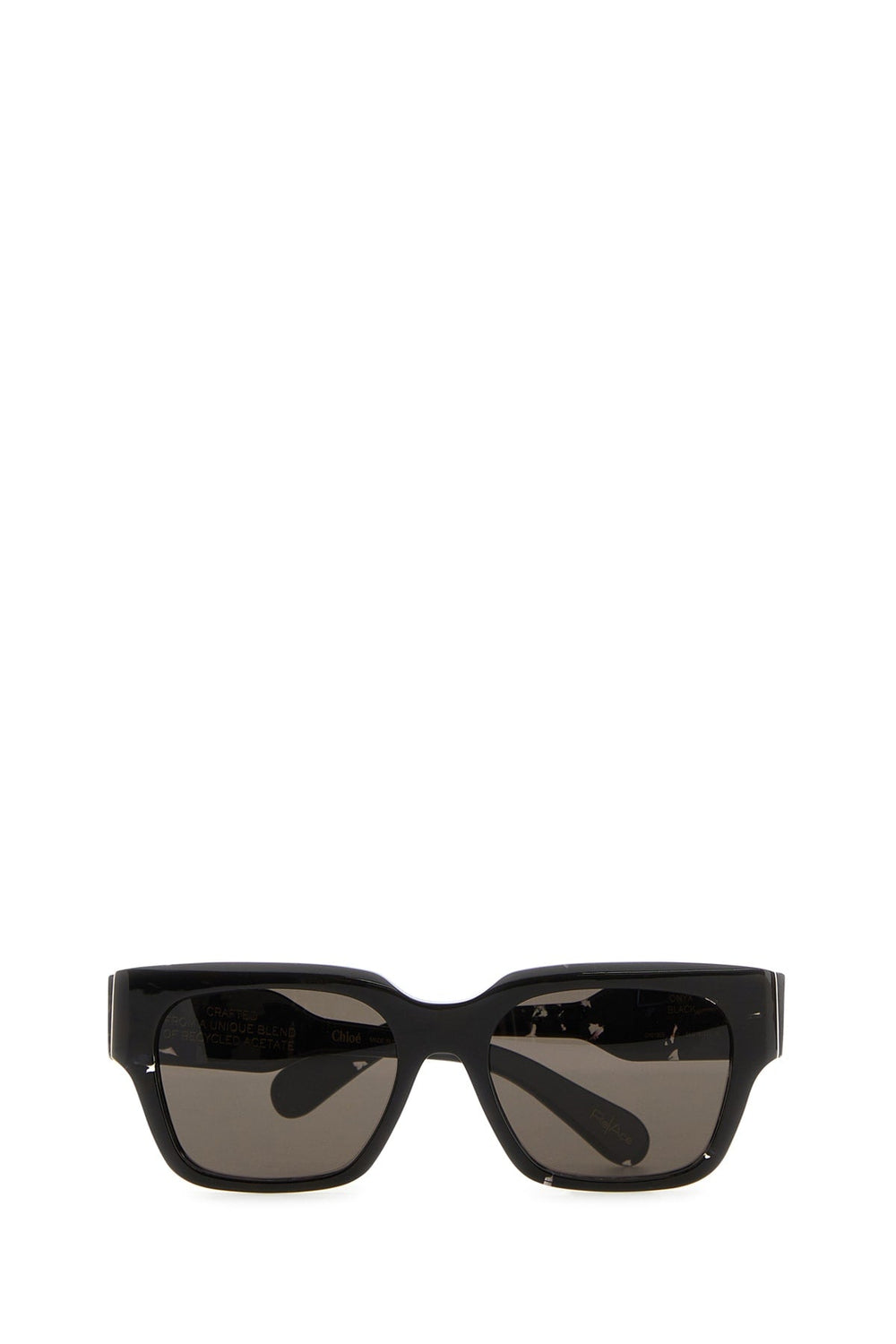 Black sunglasses with dark lenses on a white background