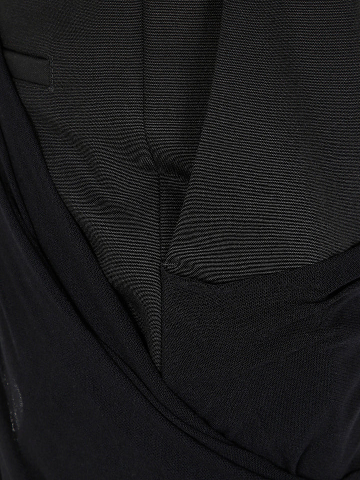 Close-up of a black suit jacket with a pocket detail