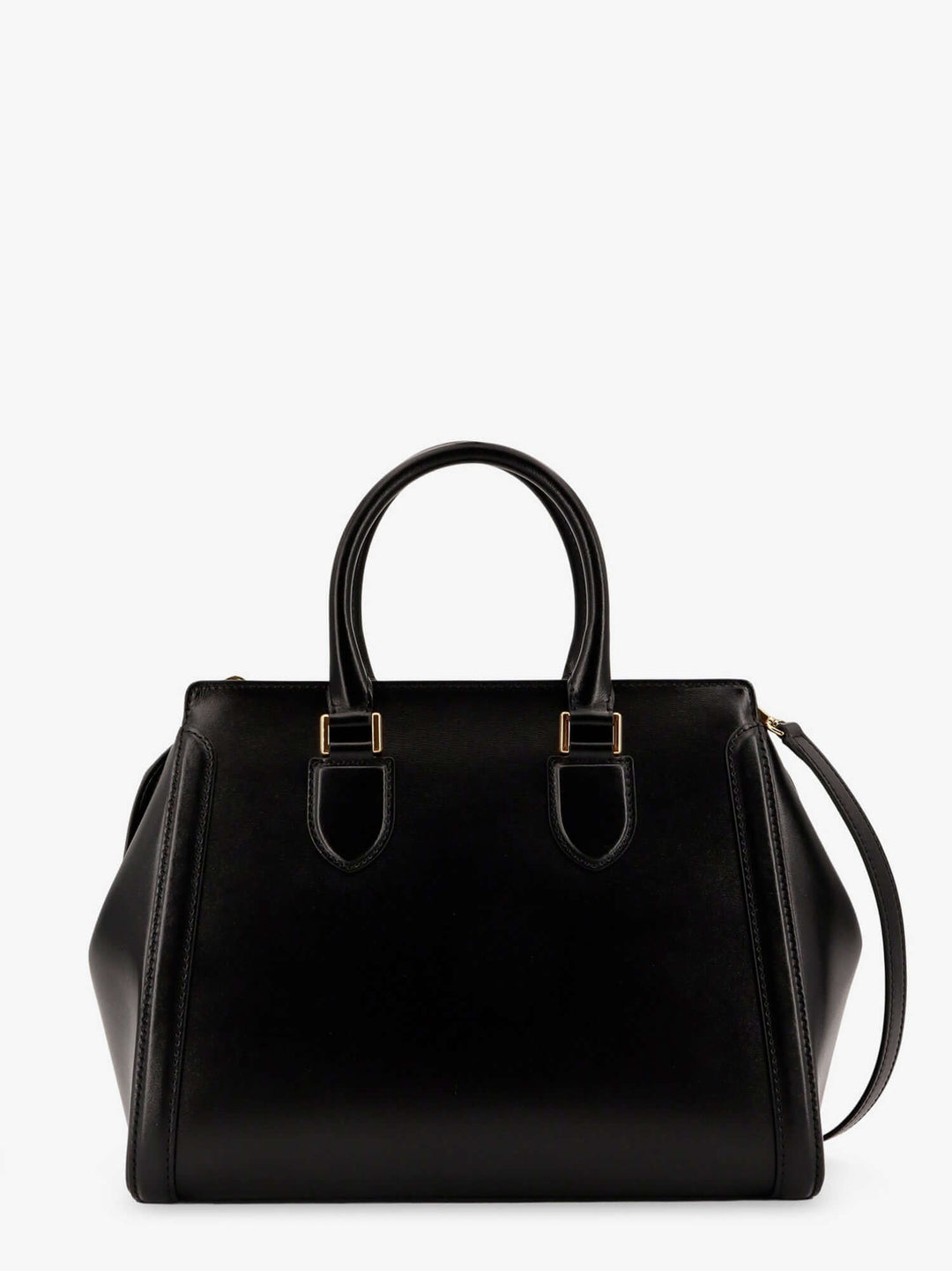 Black handbag with gold hardware on a white background