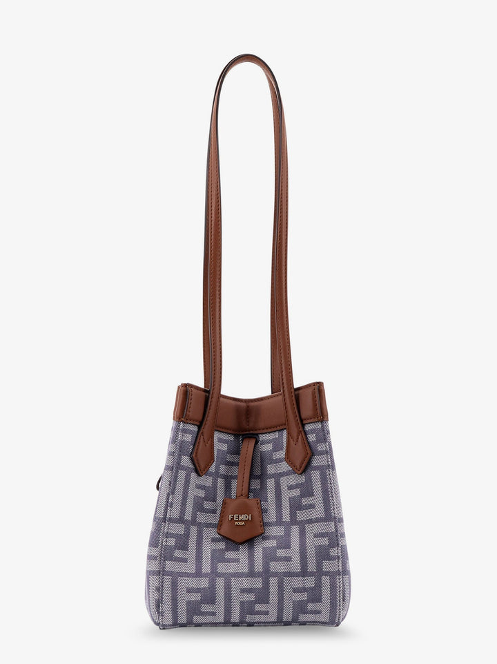 Handbag with brown handles and a patterned body on a white background