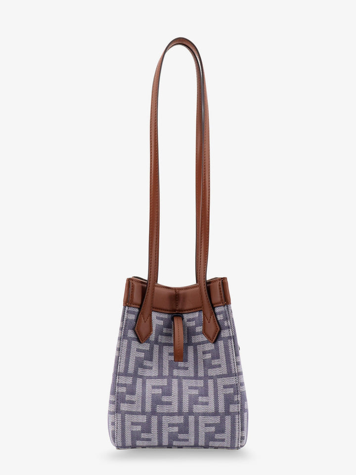 Handbag with brown handles and a patterned body on a white background