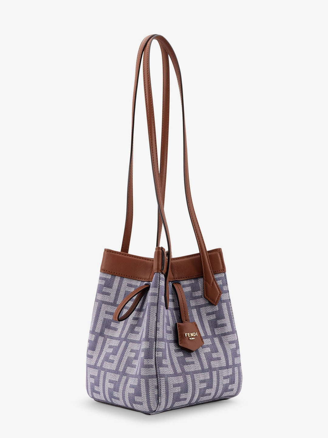 Handbag with brown straps and a patterned body on a white background