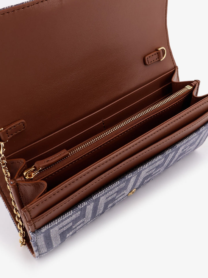 Open brown wallet with patterned flap on a white background