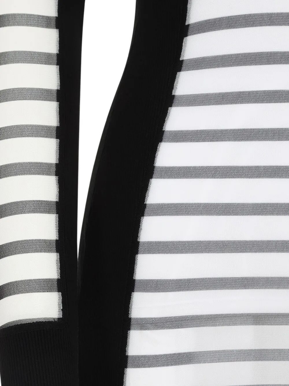 Close-up of a black and white striped fabric with a solid black section.