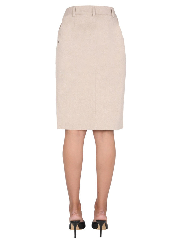 Beige pencil skirt worn by a person on a white background