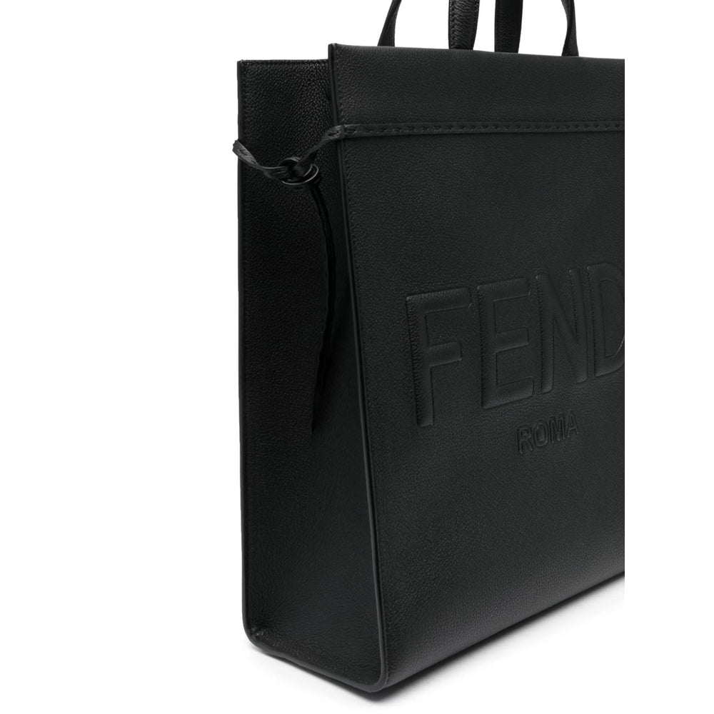 Black leather bag with 'Fendi' branding on a white background