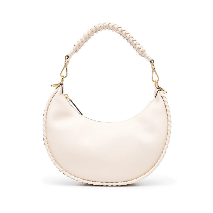 White handbag with a beaded handle on a white background