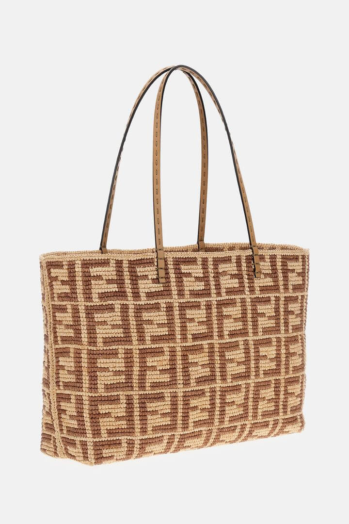Brown woven handbag with a prominent logo on a white background