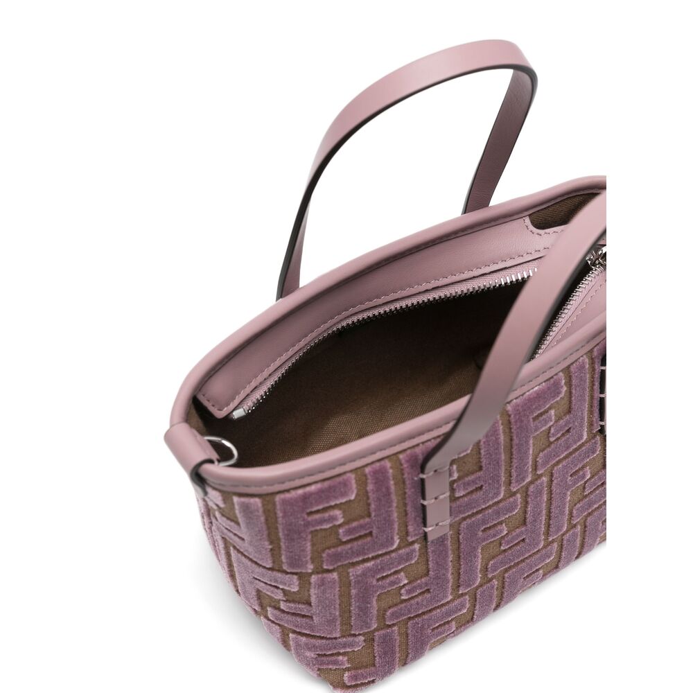 Pink handbag with a patterned design on a white background