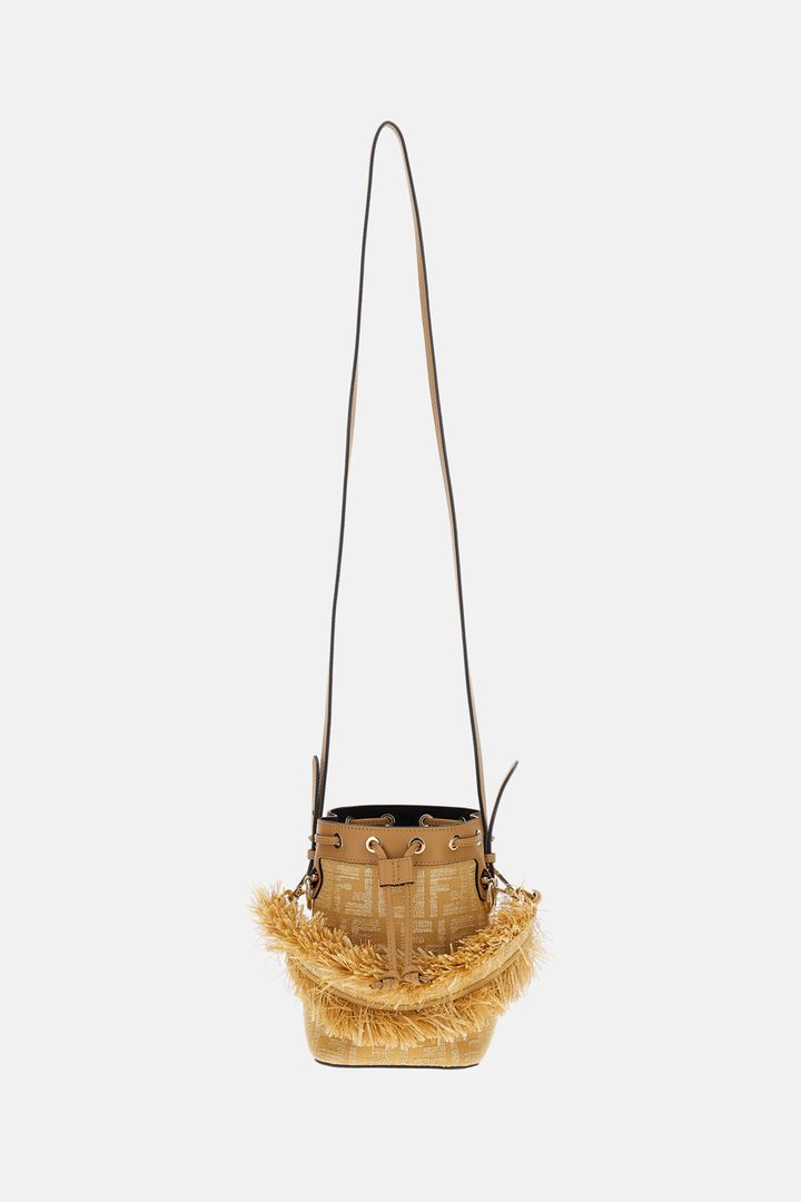 Woven handbag with frayed edge on a white background