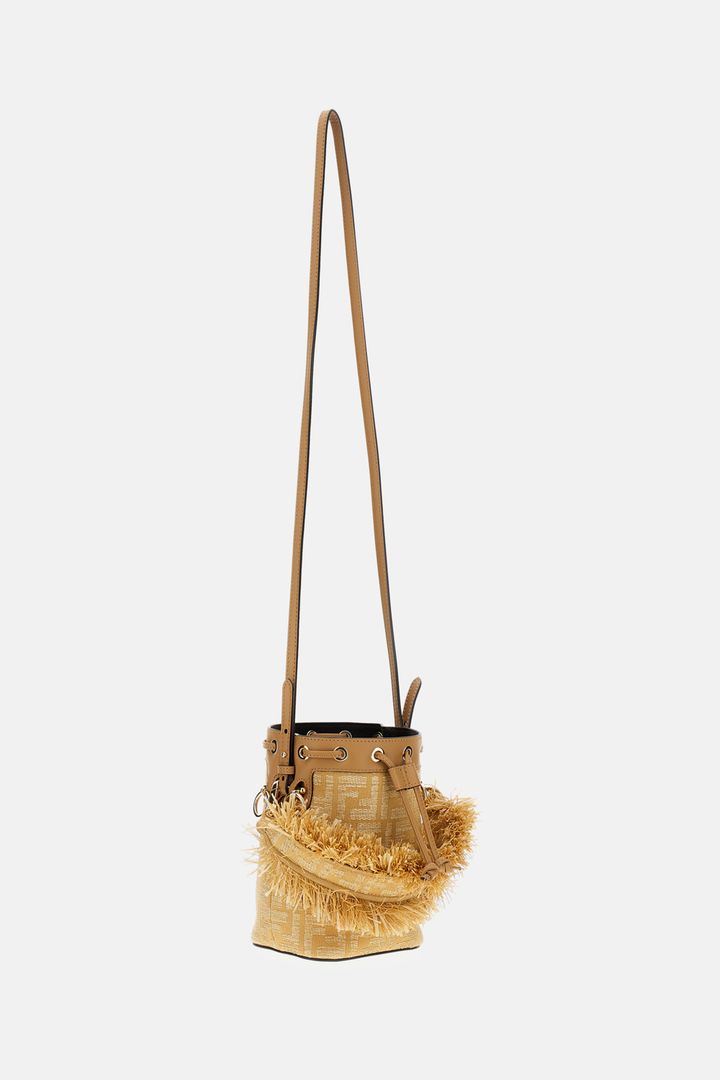 Beige handbag with frayed edge on a white background
