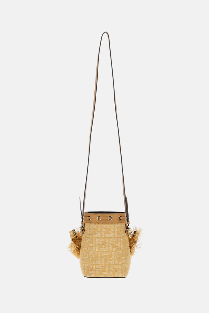 Beige woven handbag with a strap on a white background
