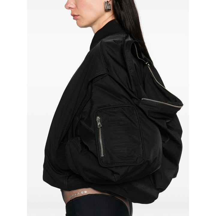 Black jacket worn by a person on a white background