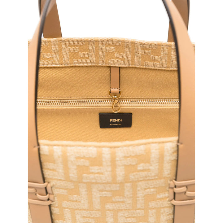 Beige handbag with Fendi logo and tag on a white background