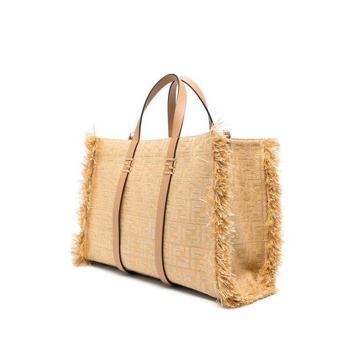 Beige straw bag with brown leather straps on a white background