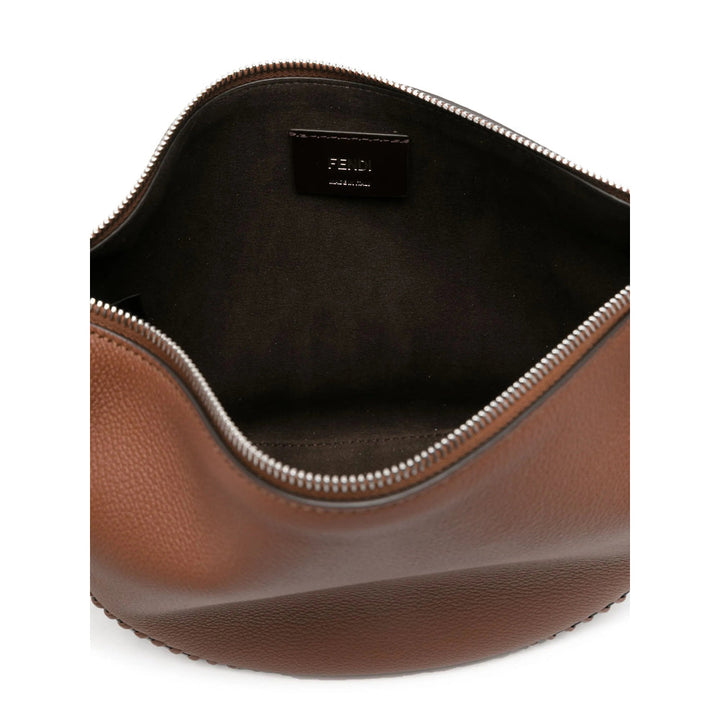 Brown leather bag with a visible brand label on a white background