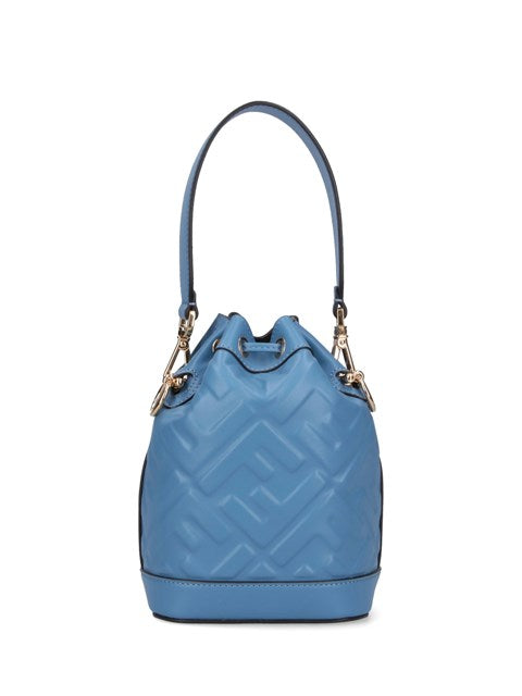 Blue quilted handbag with a handle on a white background