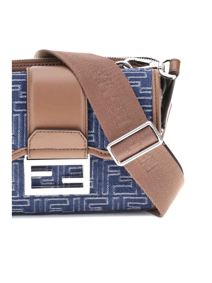 Blue bag with brown strap and buckle on a white background