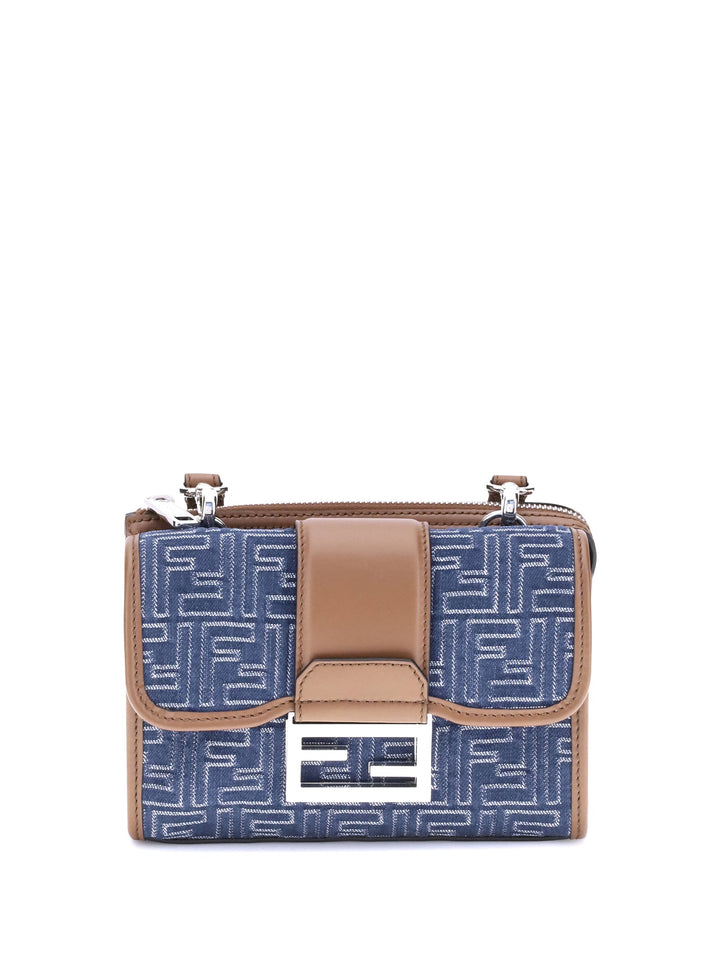 Blue patterned handbag with brown accents on a white background