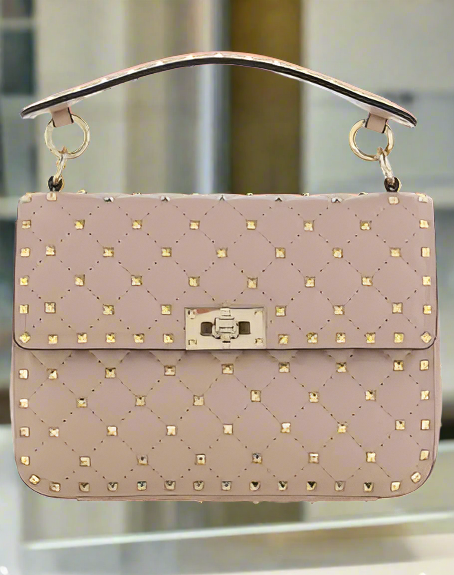 Valentino Garavani women's designer handbag in leather Luxury Valentino Garavani shoulder bag with iconic studs Valentino Garavani crossbody bag in black with gold accents