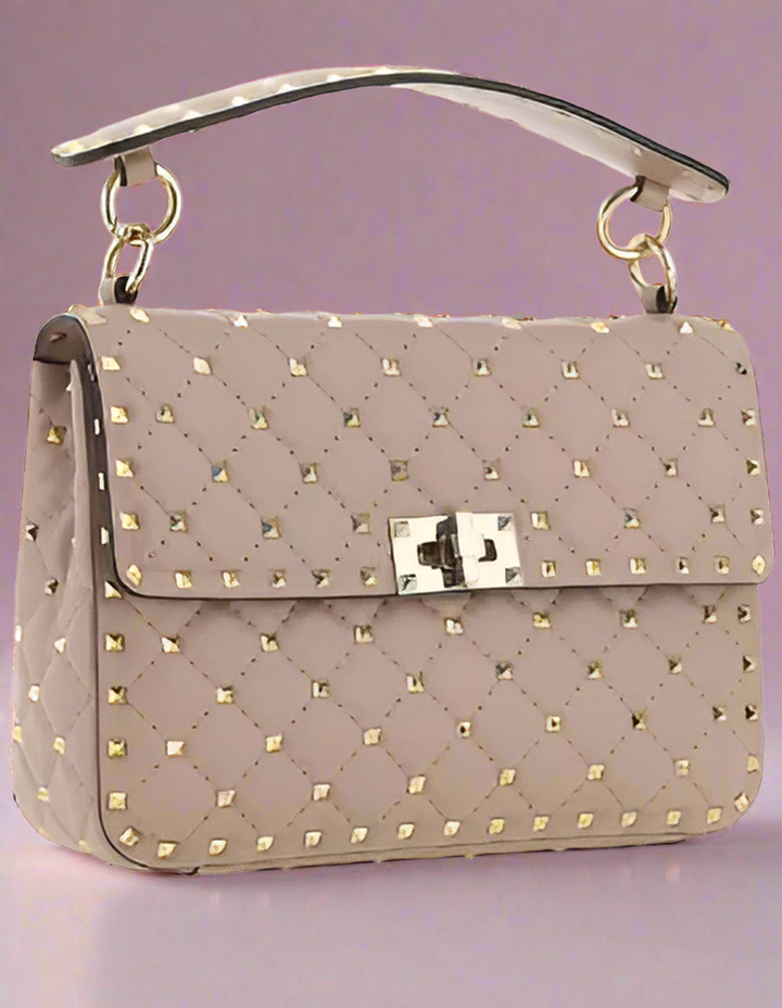 Valentino Garavani women's designer handbag in leather Luxury Valentino Garavani shoulder bag with iconic studs Valentino Garavani crossbody bag in black with gold accents