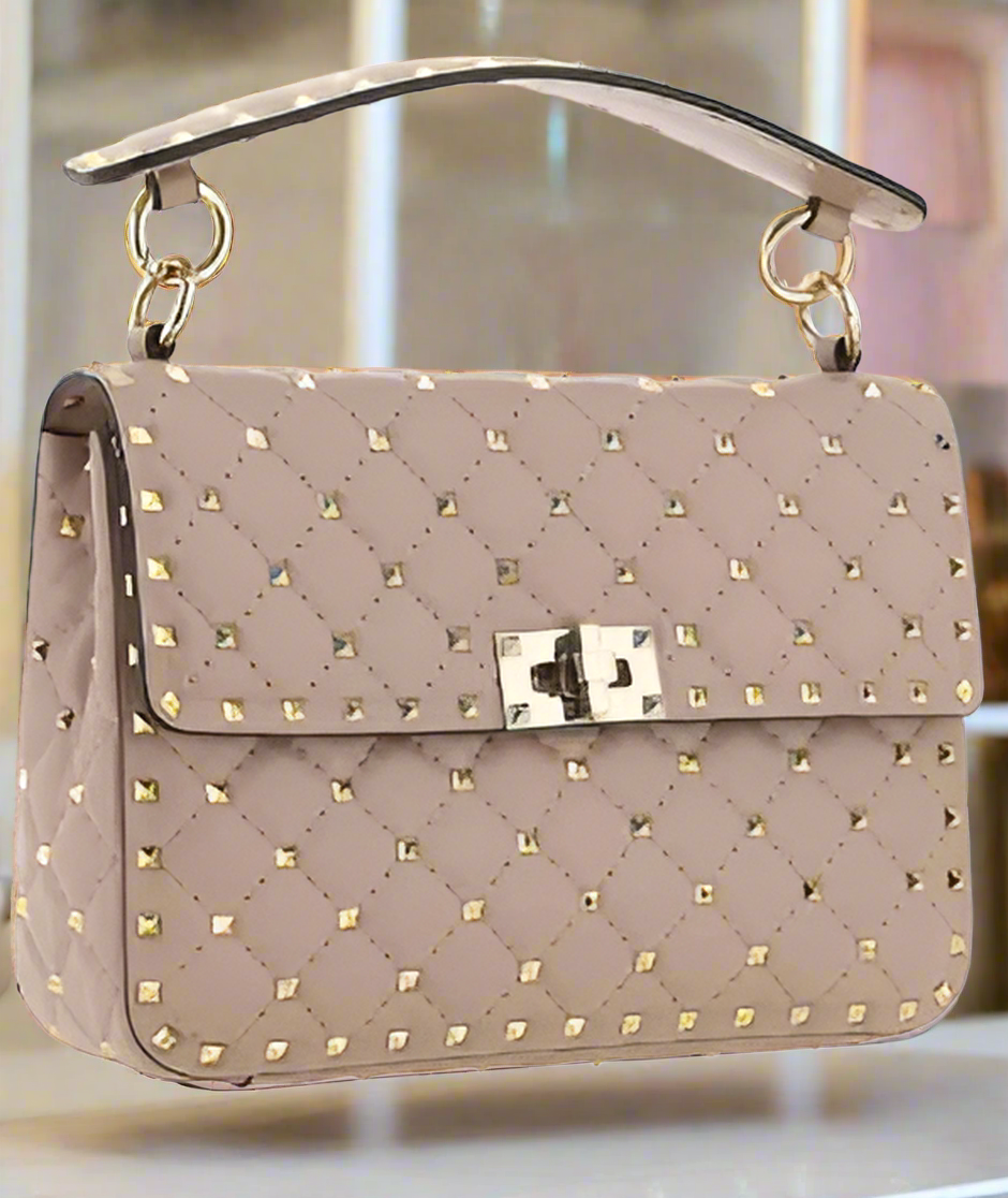 Valentino Garavani women's designer handbag in leather Luxury Valentino Garavani shoulder bag with iconic studs Valentino Garavani crossbody bag in black with gold accents