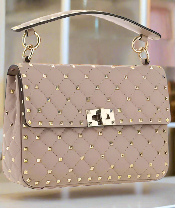 Valentino Garavani women's designer handbag in leather Luxury Valentino Garavani shoulder bag with iconic studs Valentino Garavani crossbody bag in black with gold accents