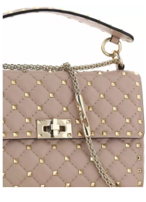 Valentino Garavani women's designer handbag in leather Luxury Valentino Garavani shoulder bag with iconic studs Valentino Garavani crossbody bag in black with gold accents